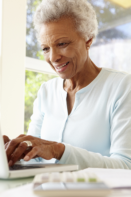 Senior Woman Using Laptop At Home Senior Woman Using Laptop At Home